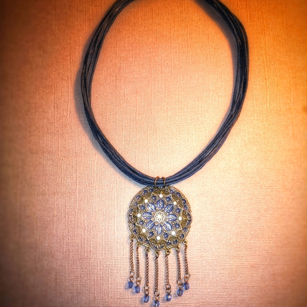 Bronze tone pendant on cord 🔥🧱